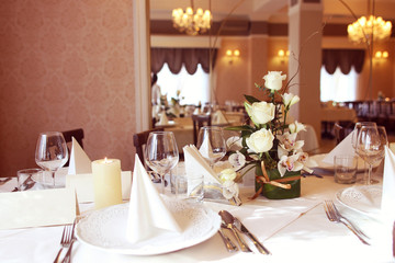 Elegant dinner table with glasses and plates