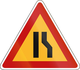 South Korea road sign - Road narrows on the right side