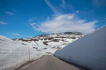 snow walls around a mountain road