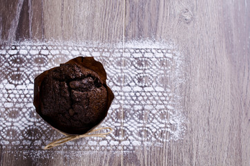Chocolate muffin in baking paper