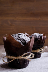 Chocolate muffin in baking paper
