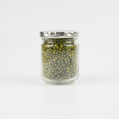 Mung bean in a mason jar over white background