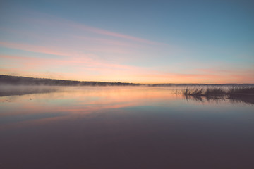 Naklejka na ściany i meble Foggy morning on the country lake - vintage effect