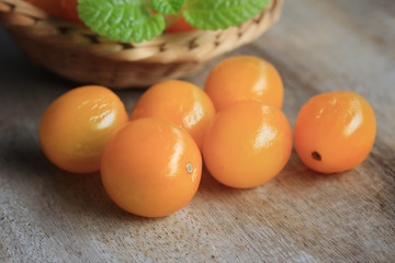 yellow tomatoes with mint leaves