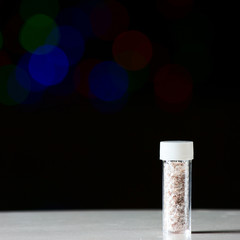 Little transparent bottle with silver stars inside