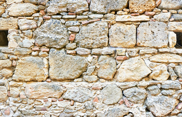 Fragment of medieval stone wall Venetian fortress.