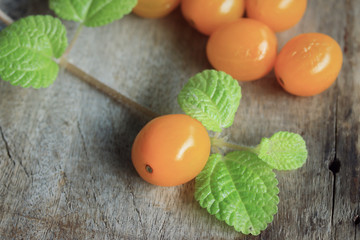 yellow tomatoes with mint leaves