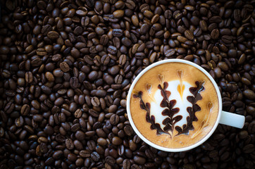 latte art coffee on coffee beans background