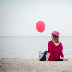 Happy girl holding air balloon