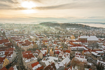 Fototapeta na wymiar Winter panorama of medieval town within fortified wall. Top view from 