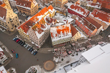 Winter panorama of medieval town within fortified wall. Top view from 