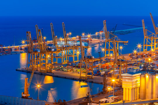 Sea cargo port at night in Barcelona, Spain.