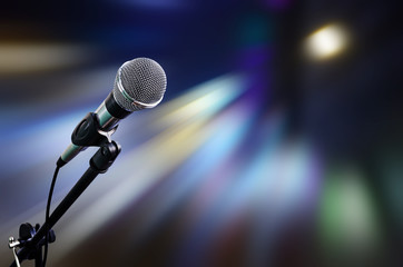 microphone on stage with moving light background