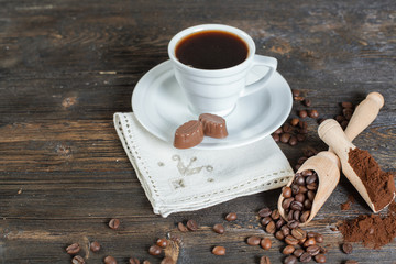 coffee cup background with coffee beans and chocolate candies