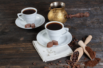 coffee cup background with coffee beans and chocolate candies