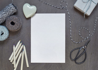Gift box with heart and old scissors.