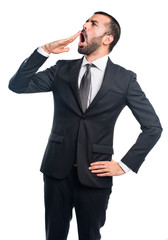 Businessman yawning