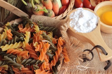 Raw homemade italian pasta colorful for cooking.