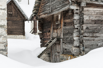 Old houses covered by snow, Italy, Alps, Piemonte, Alpe Devero