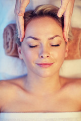 Naklejka premium close up of woman having face massage in spa