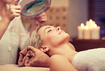 close up of young woman lying in spa