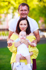 Fototapeta premium Portrait of a father, mother and baby