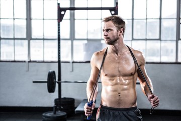 Fit man using skipping rope