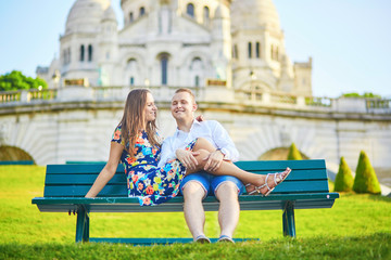 Fototapeta na wymiar Romantic couple near Sacre-Coeur cathedral on Montmartre, Paris
