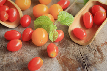 Naklejka na ściany i meble fresh tomatoes with mint leaves