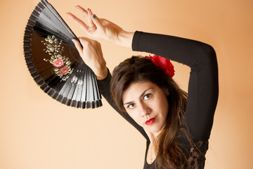 Girl posing with black fan