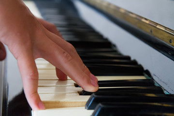 Hands playing piano