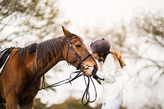 Young woman with her horse
