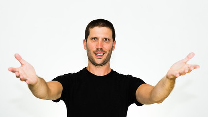 Fototapeta premium You are welcome! Close-up of young caucasian man smiling with arms up - isolated on white background