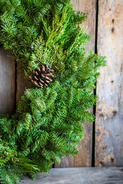 Christmas tree wreath on rustic wooden background