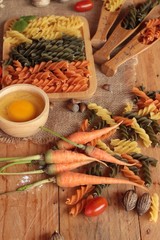 Raw homemade italian pasta colorful for cooking.