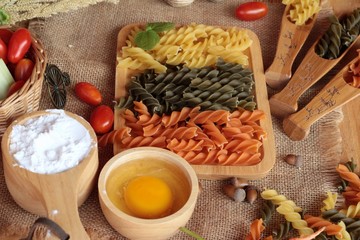 Raw homemade italian pasta colorful for cooking.