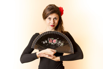 Girl posing with a  fan