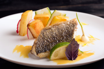 Fried dorado with baked potato