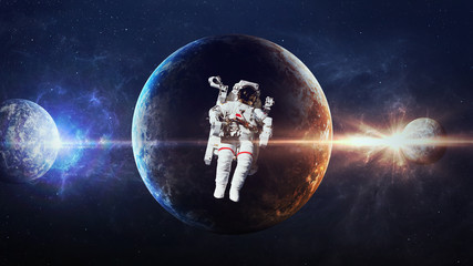 Astronaut in outer space against the backdrop of the planet. Elements of this image furnished by NASA