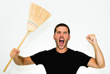 close-up of aggressive caucasian man screaming at you and holding a broom -  isolated on white background with copyspace
