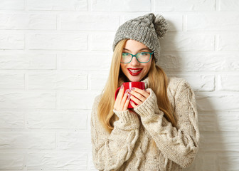 Smiling Hipster Girl in Winter Clothes with Mug - 98182910