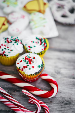 Christmas cupcakes on wooden background