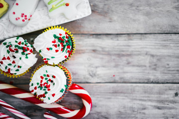 Christmas cupcakes on wooden background