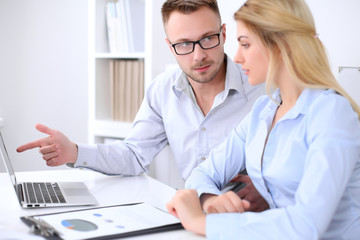 Obraz premium Two successful business partners working at meeting in office