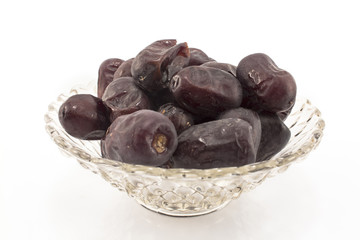 Fresh dates in a glass bowl