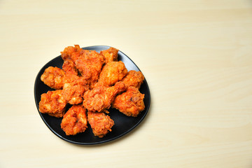 Fried chicken on wooden background