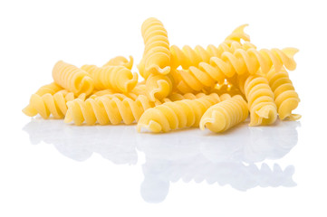 Dried corkscrew shape pasta or fusilli pasta over white background