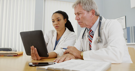 Fototapeta premium Two doctors working together in the office