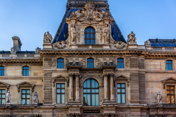 Fototapeta premium Louvre building at courtyard of Louvre Museum at sunset. Paris.