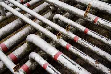 array of old pipes with arrows